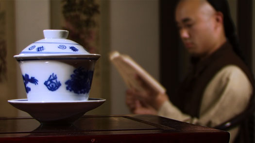 The serving tea scene that has been color corrected using Apple Color.